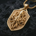 Load image into Gallery viewer, Gold plated kraken octopus shield pendant necklace presented on porous volcanic rock, highlighting the nautical sea creature motif in a luxurious close-up jewelry image.