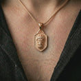 Load image into Gallery viewer, Rose gold plated gorilla shield pendant necklace worn on the neck, presented in a close-up lifestyle shot with a refined urban aesthetic.