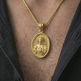 Load image into Gallery viewer, Gold plated Saint Francis pendant necklace worn on the chest, premium lifestyle jewelry photo with the Saint Francis medal centered on a spiga chain.