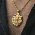 Load image into Gallery viewer, Gold plated spinning Jesus Christ pendant necklace worn on the chest, premium lifestyle jewelry photo with the rotating Jesus Christ medal centered on a spiga chain.