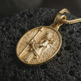 Load image into Gallery viewer, Gold plated Achaemenid soldier pendant necklace presented on porous volcanic stone, photographed in a luxurious close-up image that emphasizes the historical Persian guard motif and oval medallion silhouette.