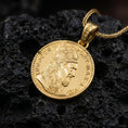 Load image into Gallery viewer, Gold plated Pope Innocent coin pendant necklace photographed on porous black volcanic stone, emphasizing the Vatican-inspired coin portrait and classical inscription in a luxury jewelry composition.