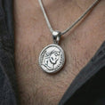 Load image into Gallery viewer, Polished silver Emperor Constans coin pendant necklace worn on the neck, shown in a clean model shot with the classical Roman emperor medallion centered for a refined antiquity-inspired look.
