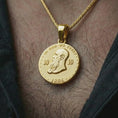 Load image into Gallery viewer, Gold plated heraldic eagle coin pendant necklace worn on the neck, captured in a premium lifestyle composition that highlights the regal double-headed eagle motif as a strong historical jewelry accent.