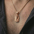 Load image into Gallery viewer, Rose gold plated Tutankhamun pharaoh pendant necklace worn on the neck, presented in an elegant model photograph with a timeless Egyptian and collector-inspired aesthetic.