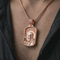 Load image into Gallery viewer, Rose gold plated Saint Padre Pio dog tag pendant necklace worn on the chest, close-up lifestyle shot featuring the sacred Saint Padre Pio design with warm rose gold tones.