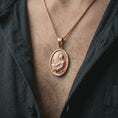 Load image into Gallery viewer, Rose gold plated Jesus Christ prayer pendant necklace worn on the chest, close-up lifestyle shot featuring the sacred Jesus Christ prayer design with warm rose gold tones.