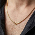 Load image into Gallery viewer, Gold plated Italian foxtail chain necklace worn on the chest, premium lifestyle jewelry photo with the woven chain resting naturally on the neck and upper chest.