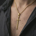 Load image into Gallery viewer, Gold plated medieval sword pendant necklace worn on the chest, premium lifestyle jewelry photo with the Templar-style sword pendant centered on a spiga chain.