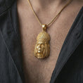 Load image into Gallery viewer, Gold plated feather headdress chief pendant necklace worn on the chest, premium lifestyle jewelry photo with the tribal-inspired portrait pendant centered on a spiga chain.