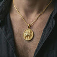 Load image into Gallery viewer, Gold plated Assyrian Lamassu pendant necklace worn on the chest, premium lifestyle jewelry photo with the Mesopotamian guardian pendant centered on a spiga chain.