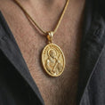 Load image into Gallery viewer, Gold plated Saint Andrew pendant necklace worn on the chest, premium lifestyle jewelry photo with the Saint Andrew medal centered on a spiga chain.