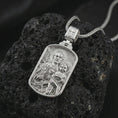 Load image into Gallery viewer, Polished silver Saint Joseph and Jesus pendant necklace on textured volcanic rock, centered macro jewelry photo with detailed Catholic medal engraving and bright silver highlights.