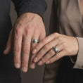 Load image into Gallery viewer, Oxidized Bushido sword band ring worn on the finger, close-up lifestyle jewelry photo showing the samurai-inspired ring on a hand with dark clothing.