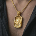 Load image into Gallery viewer, Gold plated Saint Padre Pio dog tag pendant necklace worn on the chest, premium lifestyle jewelry photo with the Saint Padre Pio medal centered on a spiga chain.