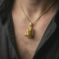 Load image into Gallery viewer, Gold plated hippo head pendant necklace worn on the chest, premium lifestyle jewelry photo with the hippo animal pendant centered on a spiga chain.