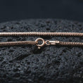 Load image into Gallery viewer, Rose gold plated Italian foxtail chain necklace on textured volcanic rock, detailed macro product shot with soft warm reflections and elegant spiga chain texture.