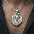 Load image into Gallery viewer, Polished silver pharaoh shield pendant necklace worn on the chest, masculine lifestyle shot highlighting the royal Egyptian portrait relief and bright silver finish.