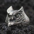 Load image into Gallery viewer, Oxidized sterling silver owl ring photographed close-up on black volcanic rock with a premium studio feel.