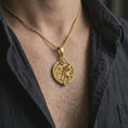 Load image into Gallery viewer, Gold plated Aquarius zodiac pendant necklace worn on the chest, premium lifestyle jewelry photo with the Aquarius water bearer pendant centered on a spiga chain.