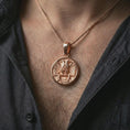 Load image into Gallery viewer, Rose gold plated Masonic double headed eagle pendant necklace worn on the chest, close-up lifestyle shot featuring the Masonic double headed eagle design with warm rose gold tones.