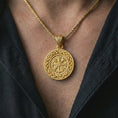Load image into Gallery viewer, Gold plated Vegvisir Viking compass pendant necklace worn on the chest, premium lifestyle jewelry photo with the Viking compass pendant centered on a spiga chain.