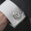 Load image into Gallery viewer, A polished silver Medusa cufflink is worn on a shirt cuff in a premium close-up lifestyle image, showing the sculpted Gorgon profile clearly.