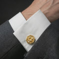 Load image into Gallery viewer, A gold plated scarab cufflink is worn on a white cuff in a close-up lifestyle shot, styled as a meaningful ancient Egyptian gift for men.