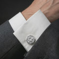 Load image into Gallery viewer, A polished silver scarab cufflink is worn on a shirt cuff in a premium close-up lifestyle image, showing the winged beetle design clearly.
