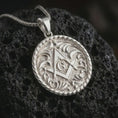 Load image into Gallery viewer, Polished silver Masonic pendant necklace on textured volcanic rock, centered macro jewelry photo with detailed Freemason emblem, textured background, and bright silver highlights.