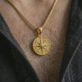 Load image into Gallery viewer, Gold plated compass rose pendant necklace worn on the chest, premium lifestyle jewelry photo with the nautical compass pendant centered on a spiga chain.