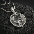 Load image into Gallery viewer, Polished silver Scorpio zodiac pendant necklace on textured volcanic rock, centered macro jewelry photo with detailed scorpion horoscope relief and bright silver highlights.