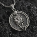 Load image into Gallery viewer, Oxidized Leo zodiac pendant necklace on textured volcanic rock, close-up studio shot highlighting the lion relief, sun detail, Leo symbol, and antique silver contrast.