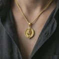 Load image into Gallery viewer, Gold plated Leo zodiac pendant necklace worn on the chest, premium lifestyle jewelry photo with the Leo lion pendant centered on a spiga chain.