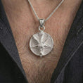 Load image into Gallery viewer, Polished silver goat pentagram pendant necklace worn on the chest, gothic lifestyle shot highlighting the bright silver finish, horned goat relief, and pentagram background.