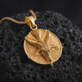 Load image into Gallery viewer, Gold plated goat pentagram pendant necklace on textured volcanic rock, premium close-up studio composition emphasizing the occult goat figure, pentagram symbol, and dark gothic amulet design.
