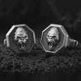 Load image into Gallery viewer, Oxidized gorilla cufflinks on textured volcanic rock, close-up studio shot highlighting the roaring ape face, octagonal frame, deep relief, and antique silver contrast.