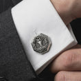 Load image into Gallery viewer, An oxidized Yggdrasil cufflink is worn on a white shirt cuff in a close-up lifestyle shot, styled with a dark suit as a meaningful Norse accessory.