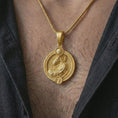 Load image into Gallery viewer, Gold plated Aries zodiac pendant necklace worn on the chest, premium lifestyle jewelry photo with the Aries ram pendant centered on a spiga chain.