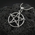 Load image into Gallery viewer, Polished silver thorn pentagram pendant necklace on textured volcanic rock, centered macro jewelry photo with detailed branch-like texture and bright silver highlights.