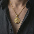 Load image into Gallery viewer, Gold plated Lion of Judah pendant necklace worn on the chest, premium lifestyle jewelry photo with the symbolic lion pendant centered on a spiga chain.