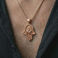 Load image into Gallery viewer, Rose gold plated hamsa hand pendant necklace worn on the chest, close-up lifestyle shot featuring the protective hamsa hand design with warm rose gold tones.