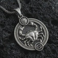 Load image into Gallery viewer, Oxidized Cancer zodiac pendant necklace on textured volcanic rock, close-up studio shot highlighting the crab relief, sun detail, Cancer symbol, and antique silver contrast.