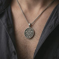 Load image into Gallery viewer, Oxidized Masonic pendant necklace worn on the chest, close-up lifestyle jewelry photo showing the square and compass medallion on a spiga chain with dark clothing.