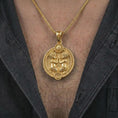 Load image into Gallery viewer, Gold plated Gemini zodiac pendant necklace worn on the chest, premium lifestyle jewelry photo with the Gemini twins pendant centered on a spiga chain.