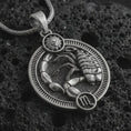 Load image into Gallery viewer, Oxidized Scorpio zodiac pendant necklace on textured volcanic rock, close-up studio shot highlighting the scorpion relief, sun detail, Scorpio symbol, and antique silver contrast.