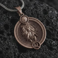Load image into Gallery viewer, Bronze Leo zodiac pendant necklace on textured volcanic rock, close-up studio shot highlighting the lion relief, sun detail, Leo symbol, and antique silver contrast.