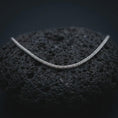 Load image into Gallery viewer, A polished silver foxtail chain necklace is displayed on black volcanic rock in a premium macro studio close-up with sharp Italian wheat chain detail.