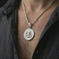 Load image into Gallery viewer, Polished silver Spartan warrior pendant necklace worn on the chest, masculine lifestyle shot highlighting the bright silver finish, sculpted armor, shield, and spear details.