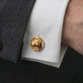 Load image into Gallery viewer, A gold plated lioness head cufflink is worn on a white cuff in a close-up lifestyle shot, styled as a meaningful groomsmen accessory for men.